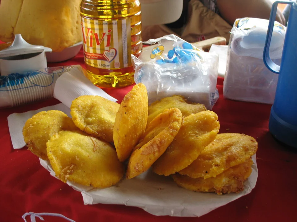 Arepa de huevo, a fried corn cake filled with egg.
