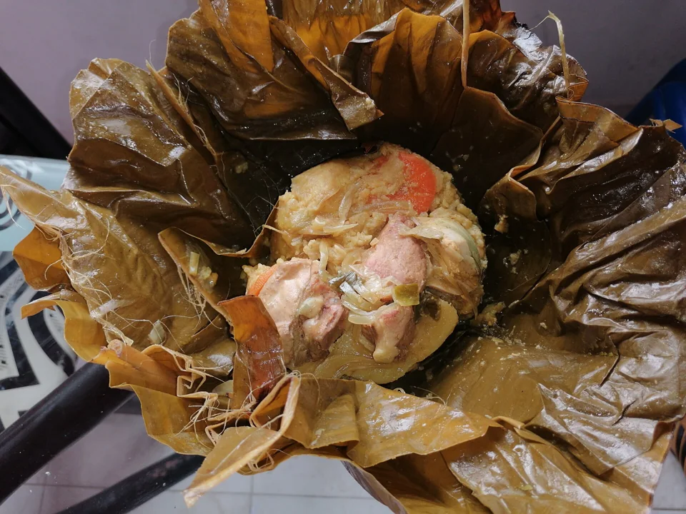 Tamal tolimense, opened from its banana-leaf wrapping.